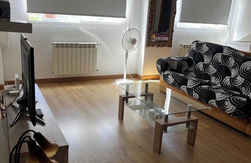 Las Rozas de Madrid Apartment | 60-square-meter loft-style apartment with a separate kitchen and bathroom, swimming pool, parking, and garden.
