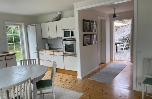 Stromstad House | House with a light interior, on a little island